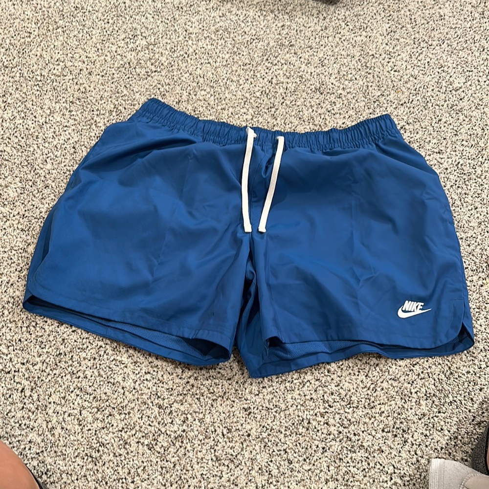 Blue Nike swim trunks